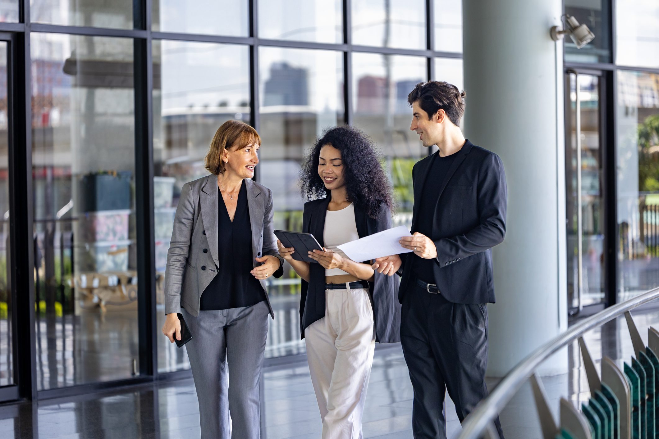 Team walking with documents