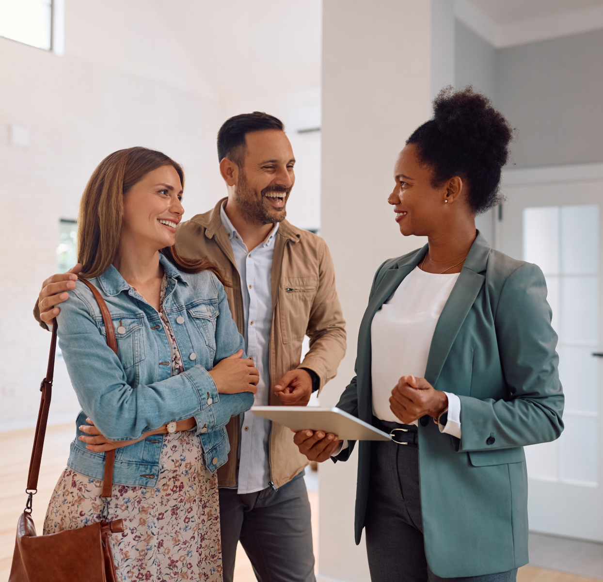 Smiling couple discussing home purchase